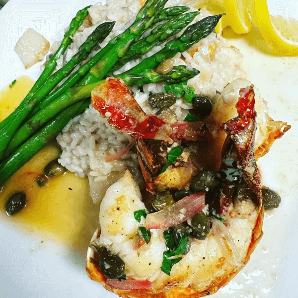 Lobster tail special with seafood risotto, piccata style
