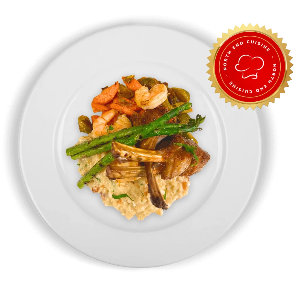 Veal chop with mushroom risotto, shrimp and asparagus on a white plate